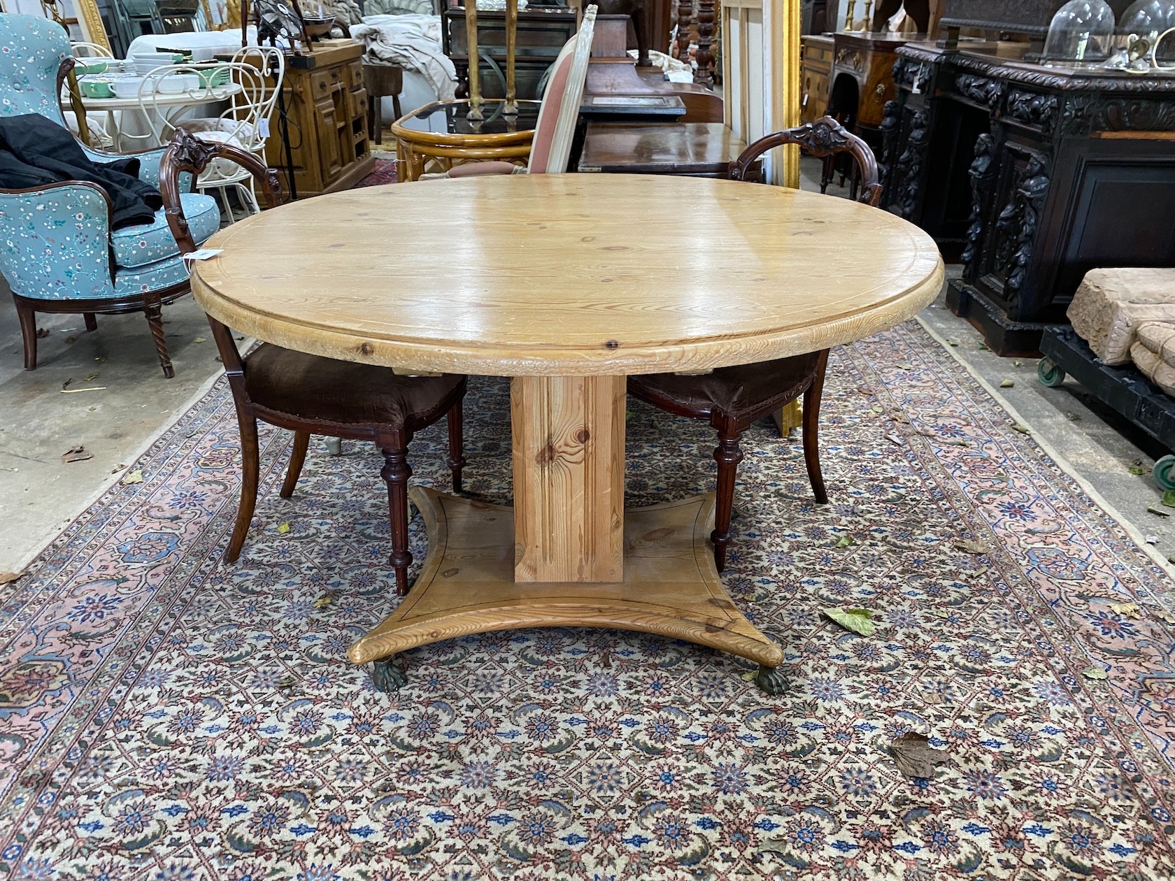 A Regency style circular pine tilt top breakfast table, diameter 120cm, height 73cm